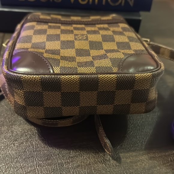 Gently used LV Danube Damier pattern with gold-tone zipper and adjustable strap - Picture 6 of 11